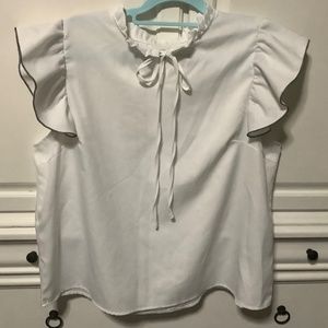 Ladies 1X white pullover blouse with tie at neck, black edge to ruffled sleeve